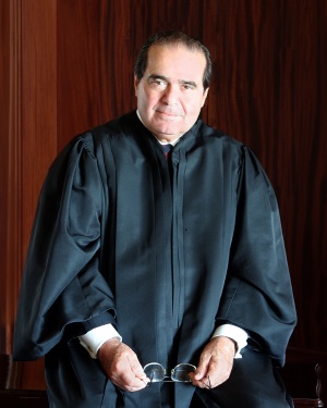 Justice Antonin Scalia poses in his robe.