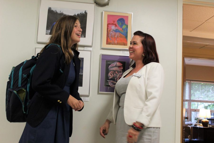  Ms. Kotarides, Upper Level Dean of Students, speaks with Isabella Conoscenti 22.