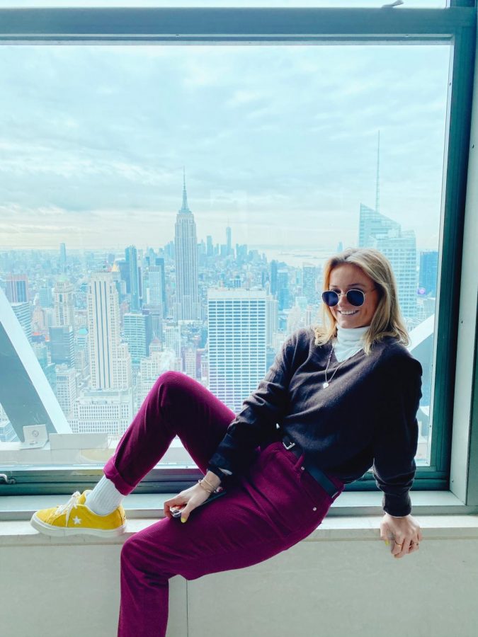 Grace Hayden lounges with a view of New York City.