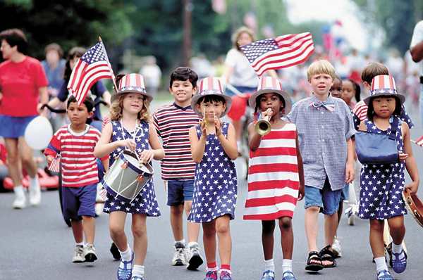 These children are enjoying a Labor Day parade to honor all of our American workers.