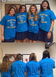 Mu Alpha Theta leadership team pose in blue pi day t-shirts.